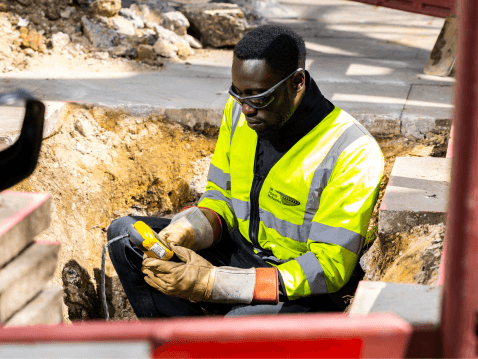 UK Power Networks engineer working in an excavation