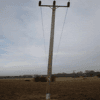 A leaning electricity pole