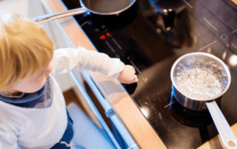 Child Touching Cooker